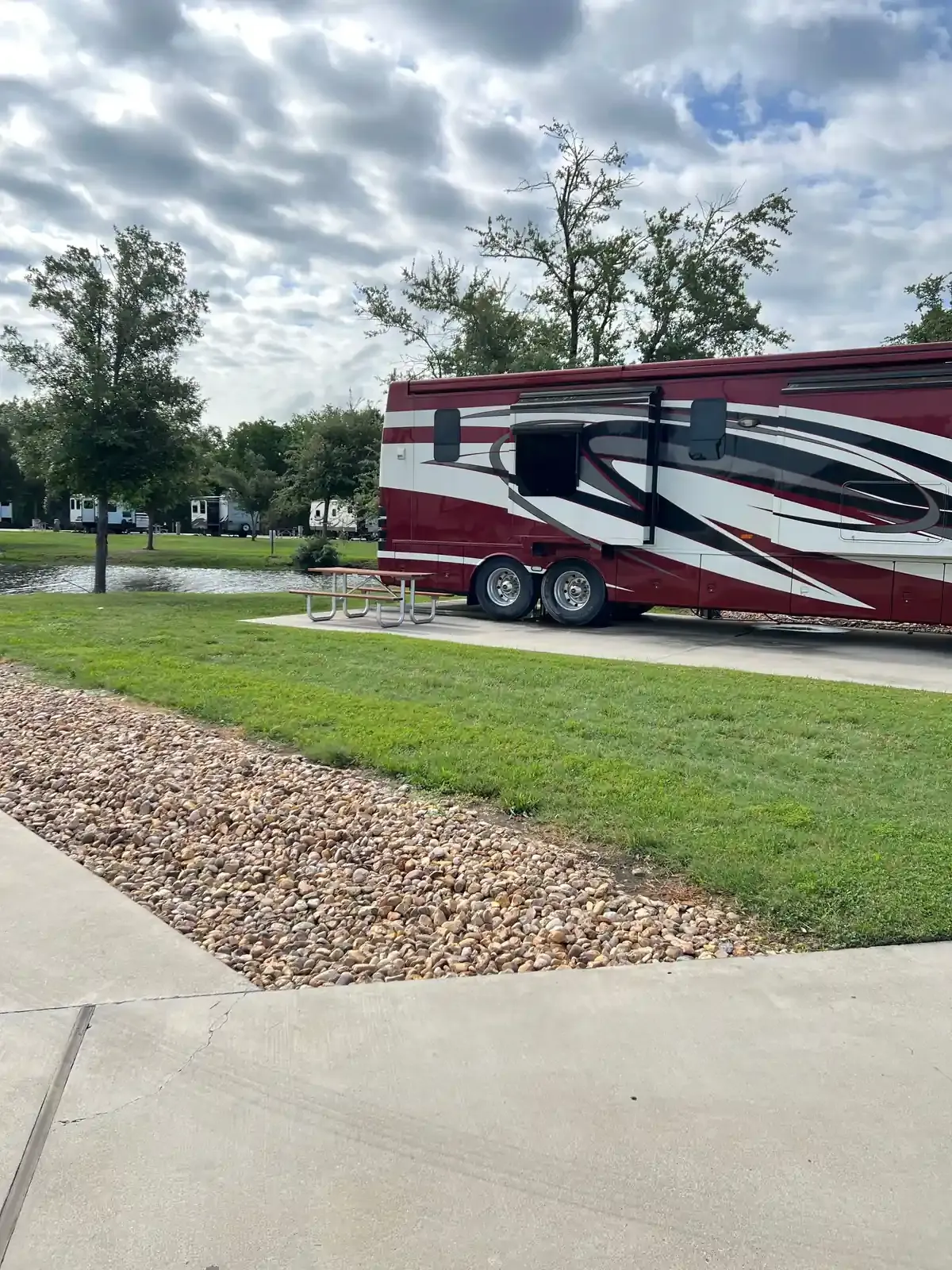 RV on concrete next to a picnic table